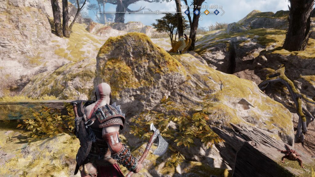 Screenshot von God of War Ragnarök mit einem Vogel auf einem Felsen.