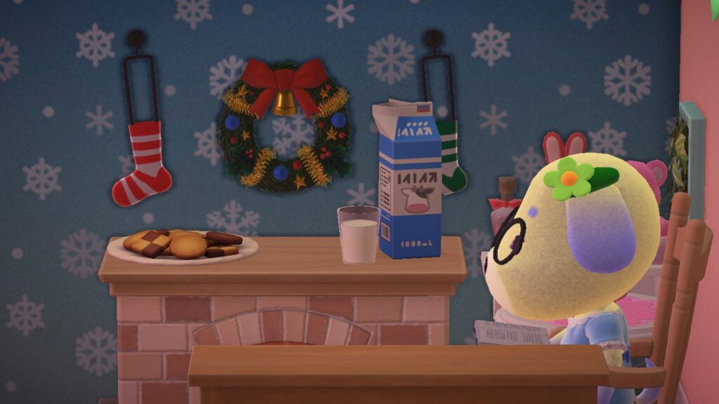 Nahaufnahme Doris mit Buch auf Schaukelstuhl und Kekse und Milch auf Kamin.